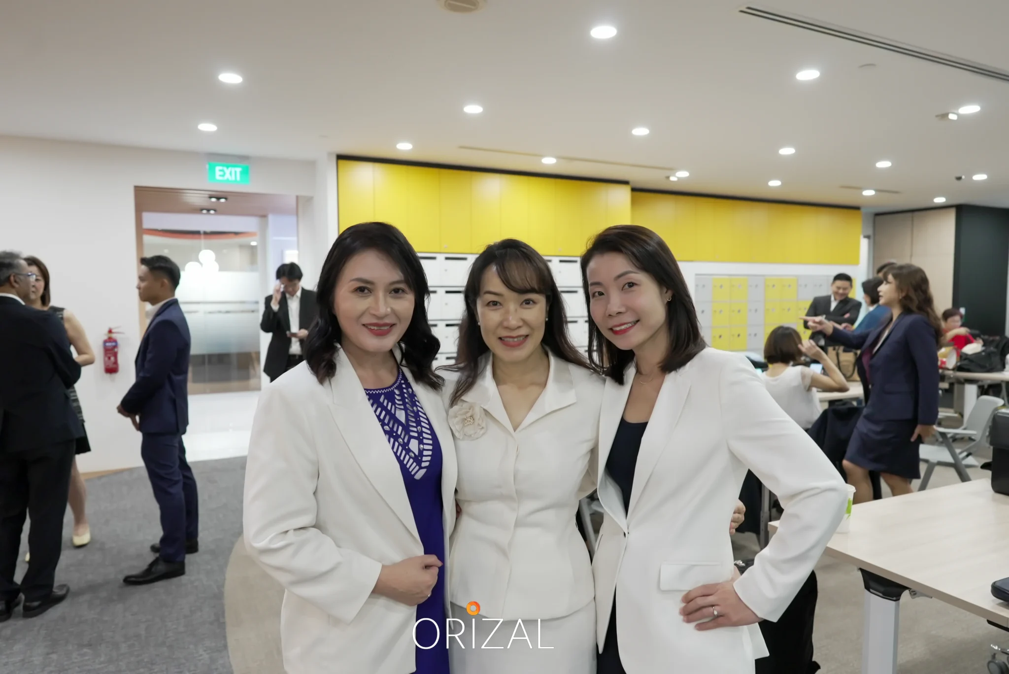 Group of female advisors taking a photo in a corporate office