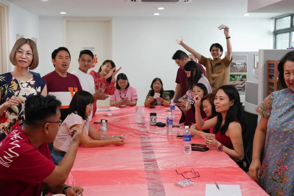 Advisors bonding over a table at Chinese New Year