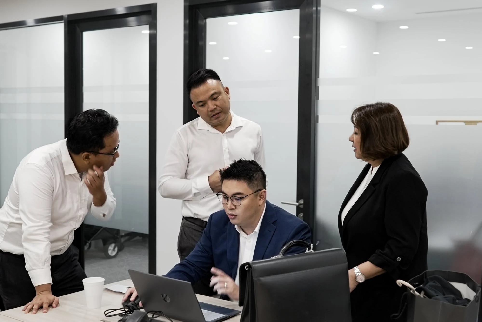 Advisors looking at computer screen