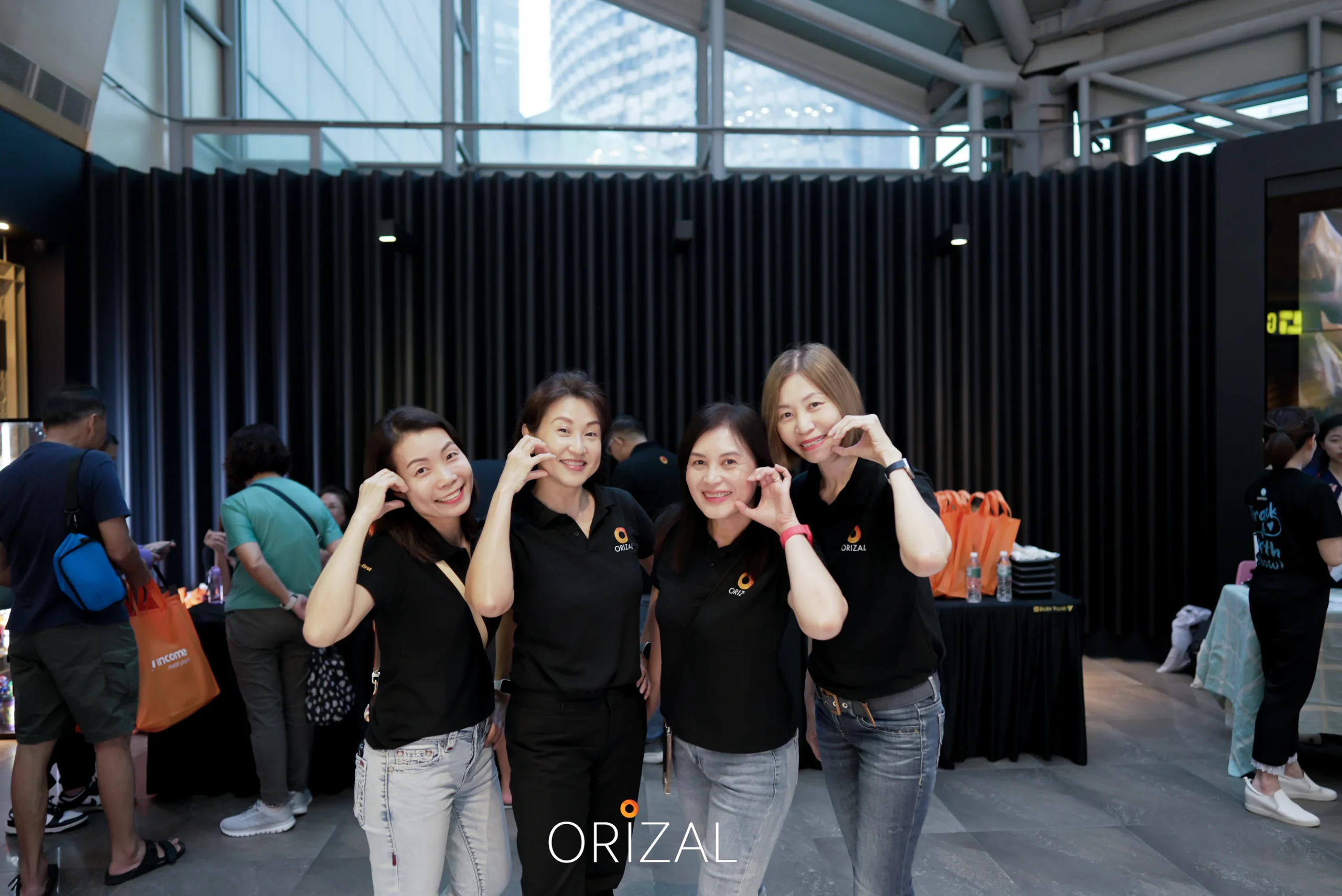 3 advisors standing in front of ticketing booth